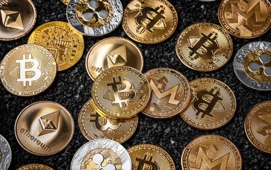 Picture of different crypto coins laying on top each other